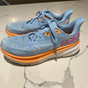 Hoka Sky Blue and Vibrant Orange Sneakers